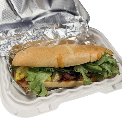 A loaded Breaker sandwich in a takeout container